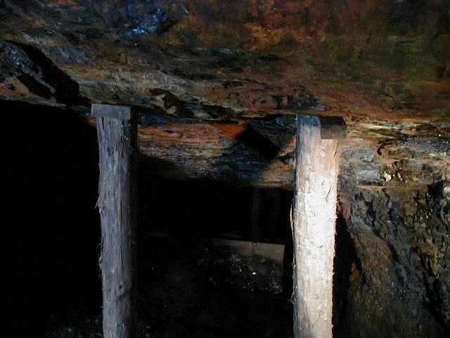 Looking downdip from the main level. A series of battery boards prevent the loose coal from sliding out of control.