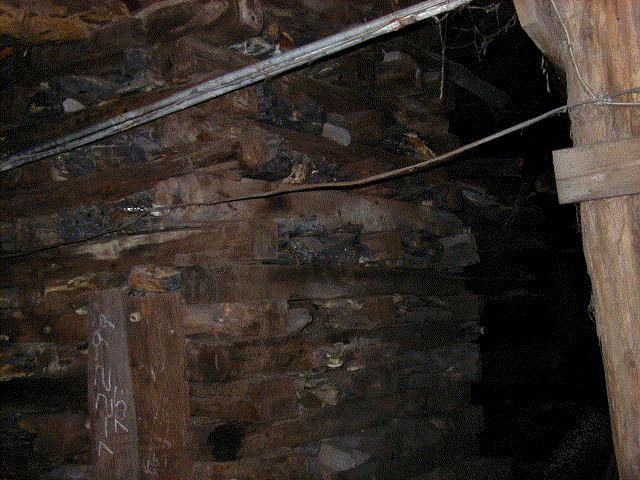 This timber cog is filled with rock, and provides very solid support for the mine's roof.