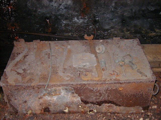 A miner's metal tool box, and some robust-looking tools.